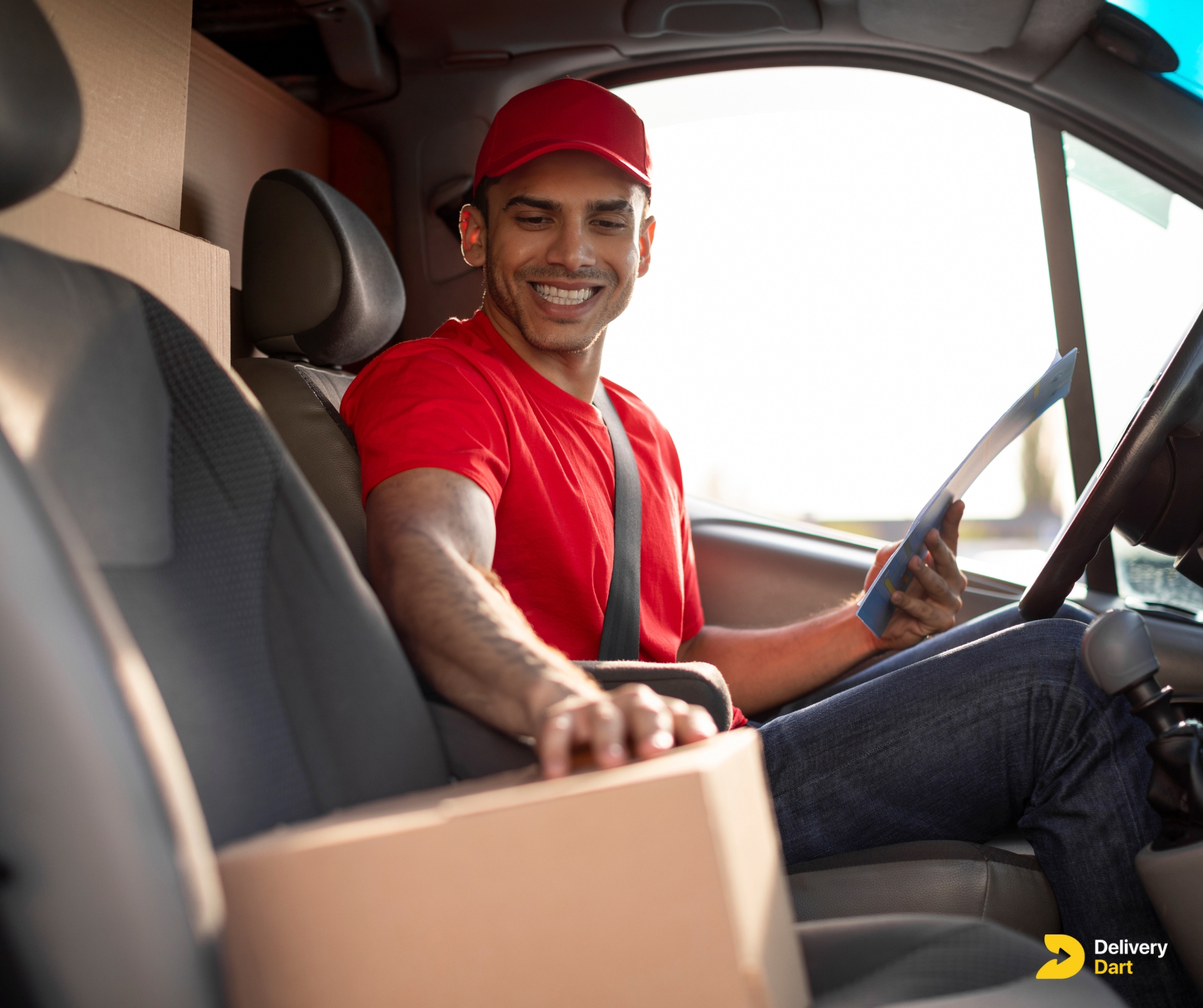 delivery truck driver smiling on duty with the DeliveryDart logo