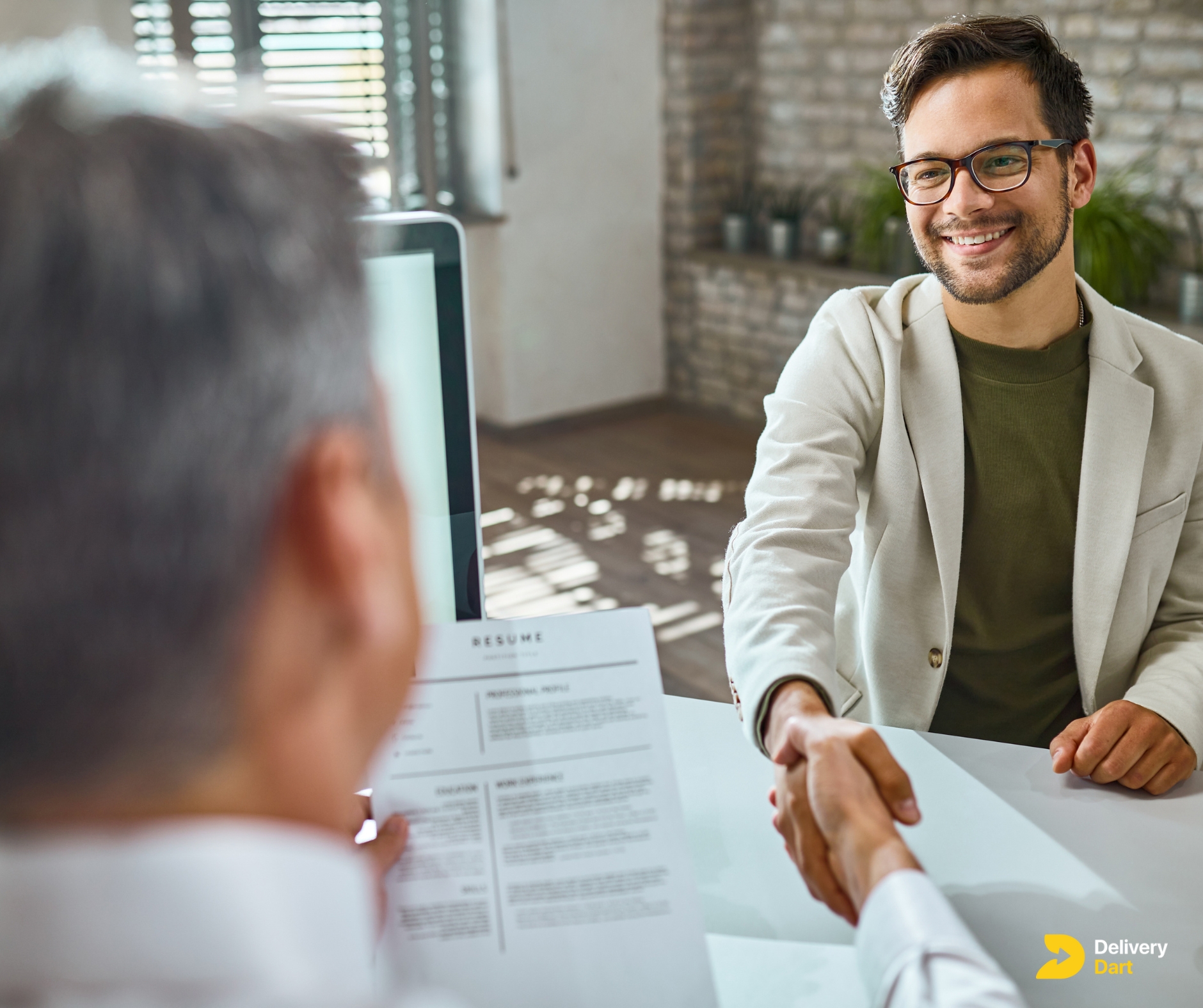 a person starting an interview along with the DeliveryDart logo