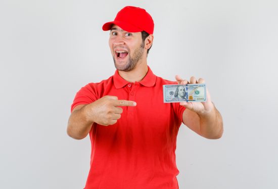 delivery driver pointing at money along with DeliveryDart logo