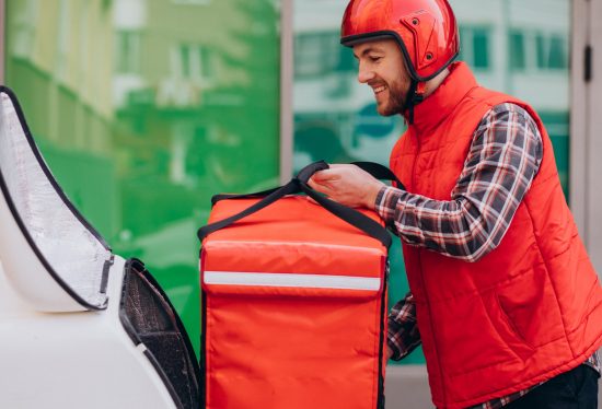 image of a delivery driver setting up his equipment with DeliveryDart logo