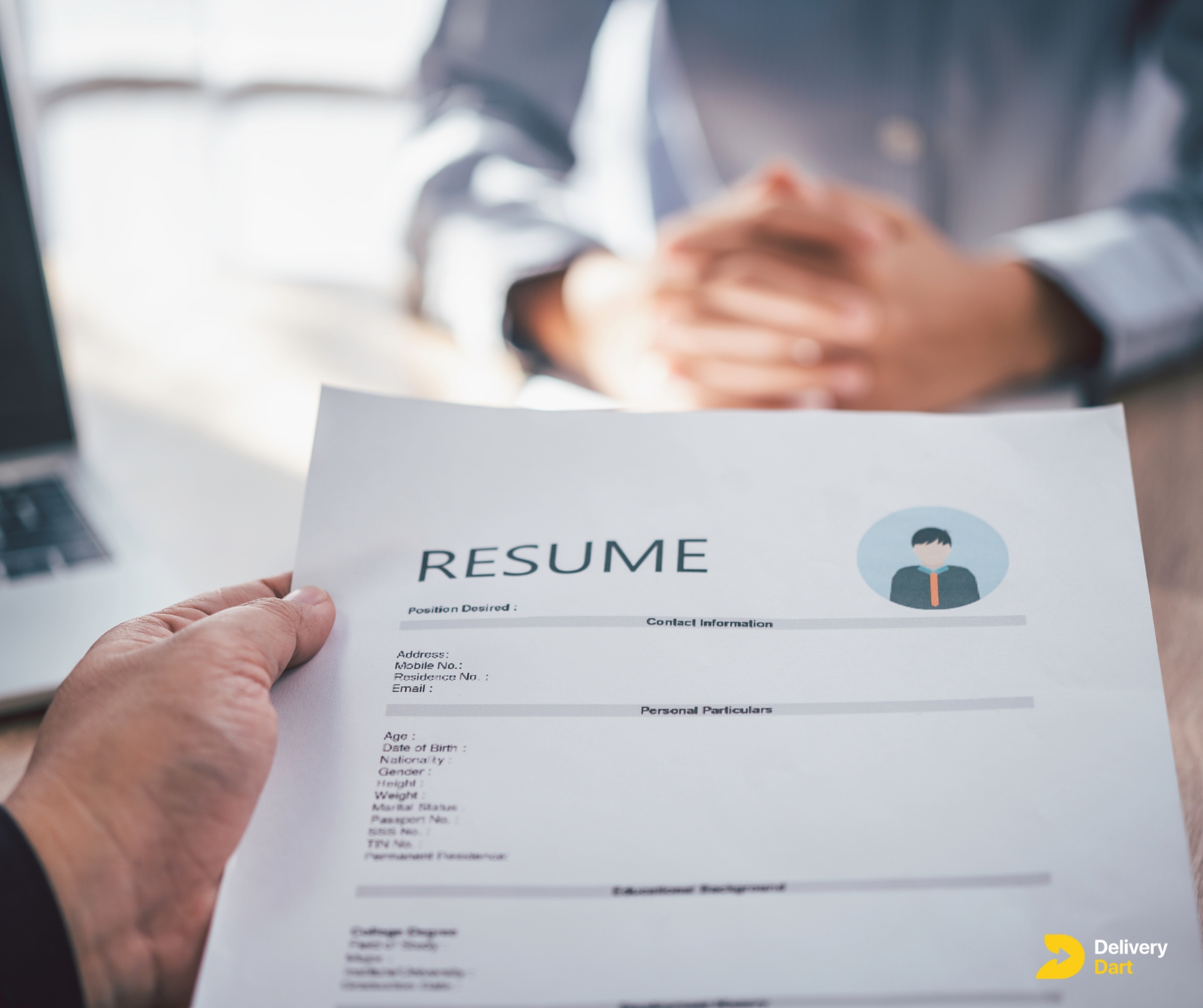 employee handing over delivery driver resume to employer