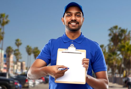 image of a delivery driver with checklist and pen along with DeliveryDart logo