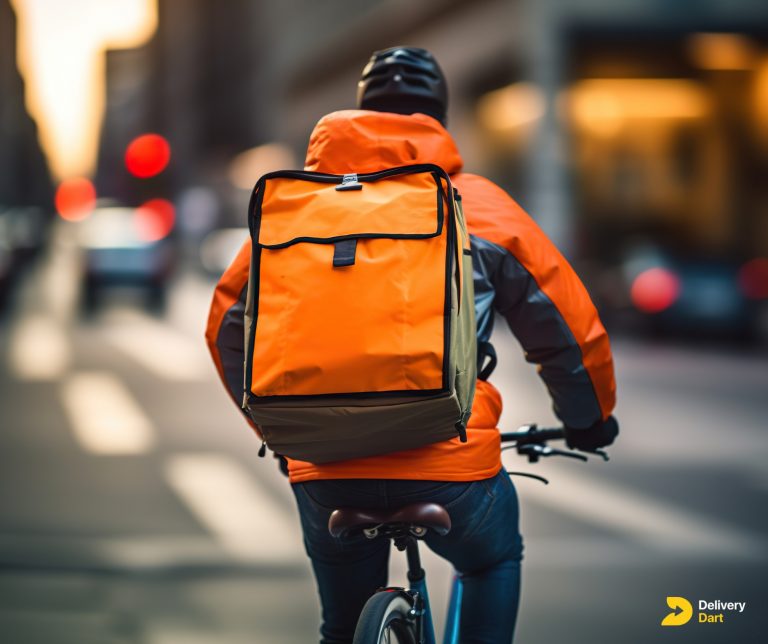 image of a food delivery driver on his bicycle going for a delivery with the DeliveryDart logo