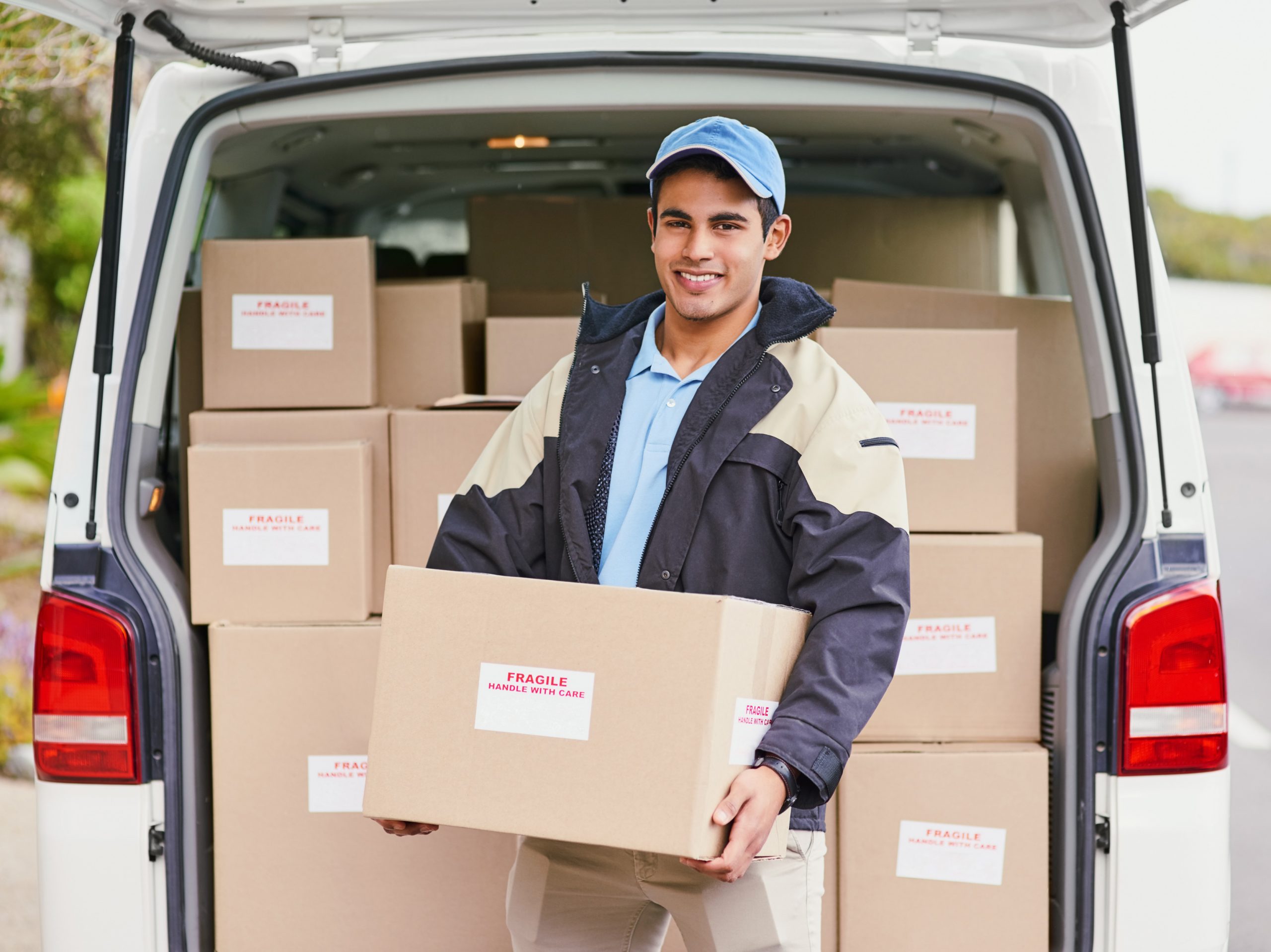 delivery truck driver holding delivery box