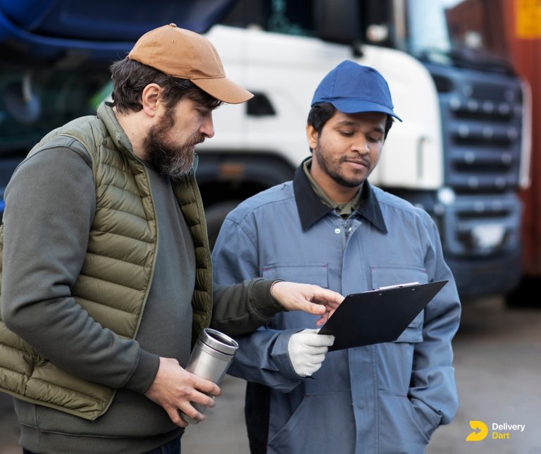 men discussing fleet asset management along with DeliveryDart logo