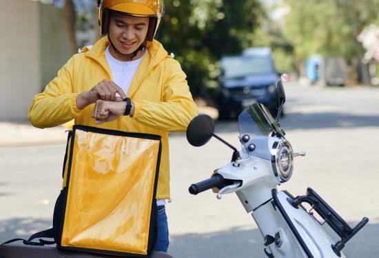 freelance delivery driver at work along with DeliveryDart logo