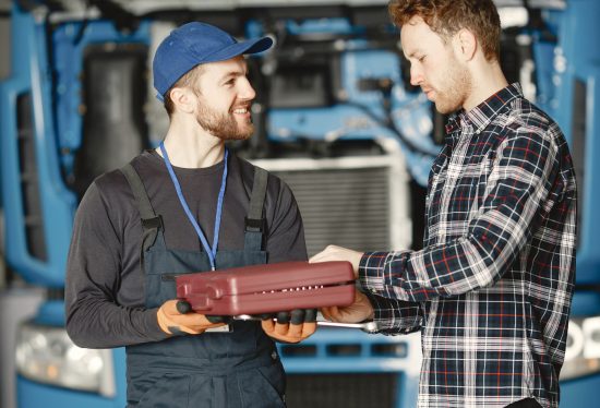 fleet maintenance workers along with deliverydart logo