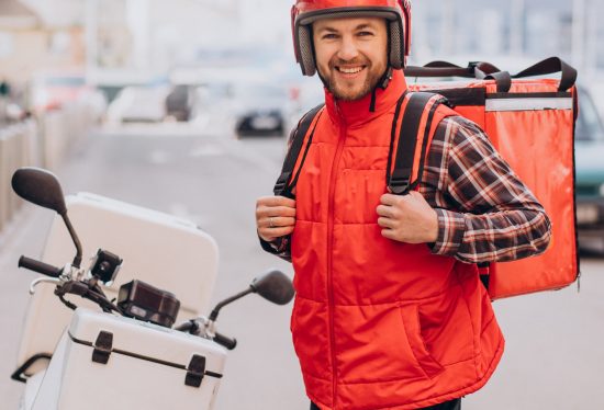 food delivery driver on his way to work along with DeliveryDart logo